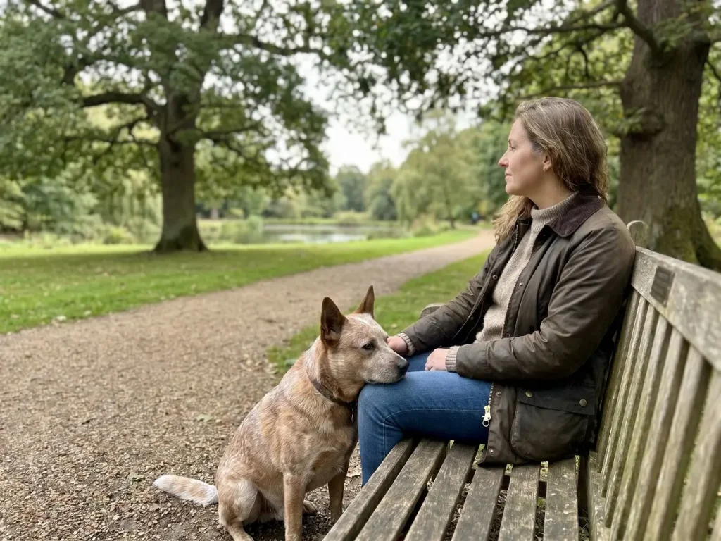 australian-cattle-dog-owner-bond Australian Cattle Dog sitting with owner showing loyalty