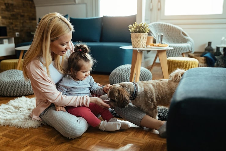 Small Dog Breeds: Best Tiny Dogs for Families, Apartments & First-Time Owners young-happy-mother-her-small-daughter-having-fun-with-their-dog-living-room